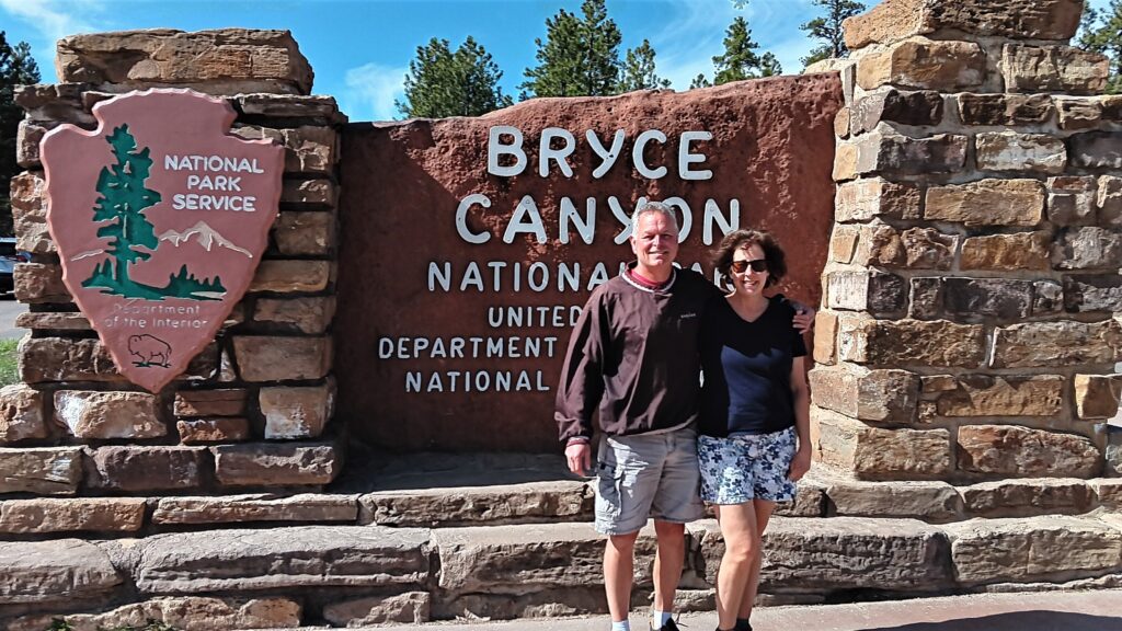 Karen and Steve at Bryce Canyon National Park Entrance Sign