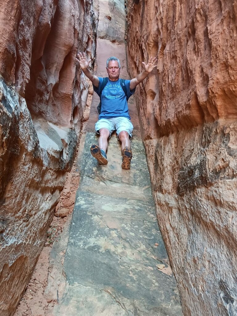 Steve in a slot canyon on the Cohab Canyon Trail