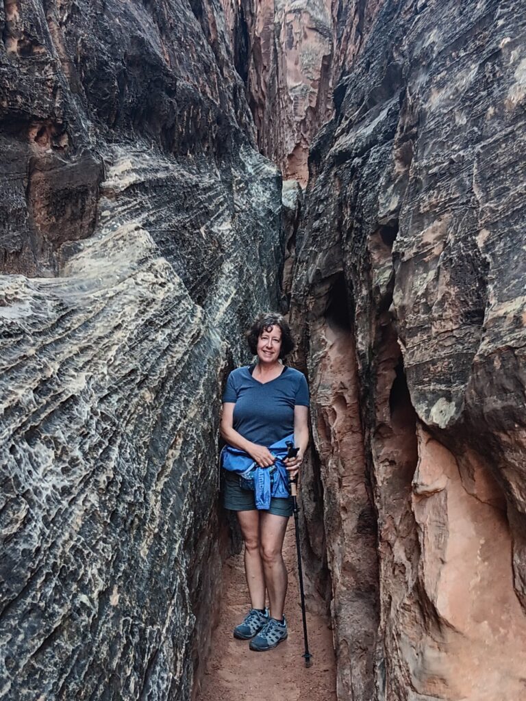 Karen in a slot canyon on the Cohab Canyon Trail