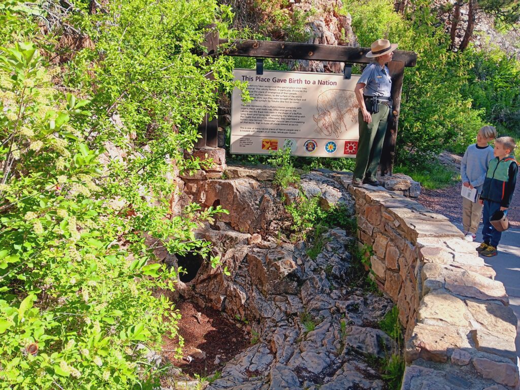 Park Ranger by the natural entrance to Jewel Cave
