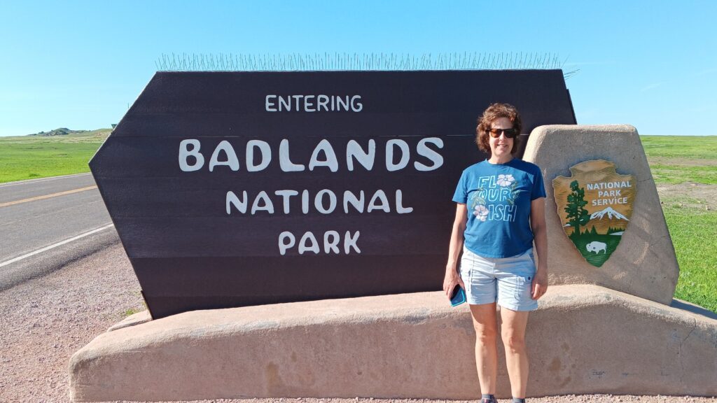 Karen at Badlands National Park entrance sign